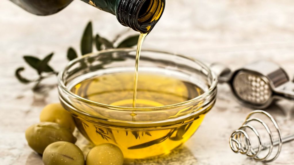 A small bowl of aromatic olive oil.
